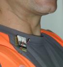 Conversation Finder badge mounted on shirt, near neck of the user.