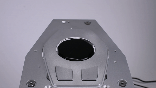 This video shows a close-up of the v2 working controller. In addition to robotically changing its diameter, it can also disappear in the arm rest. This was requested as a feature by the OEM we were working with. This �hidden until in use� capability would make sure that the knob is flush with the arm rest, unless it is getting used. This video also shows how fast, or slow, the device can change its diameter, and the �wiggles� it can produce using minute shape changes. Note that such wiggling is not the same as traditional haptics (vibration), since it uses the human sense of proprioception, and not the vibration senses in our fingers.