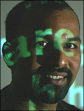 Sunil Vemuri records his conversations and converts them into searchable transcripts (shown here playfully projected on him).